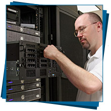 Technician performing maintenance on servers